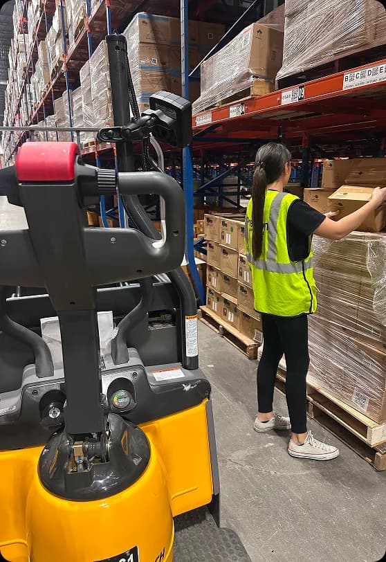 Precision team members working safely in a logistics facility